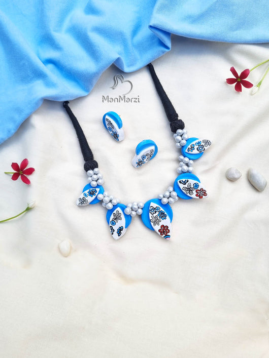 Graceful Blossoms- Handcrafted Sky & White Terracotta Jewellery Set with Floral Art