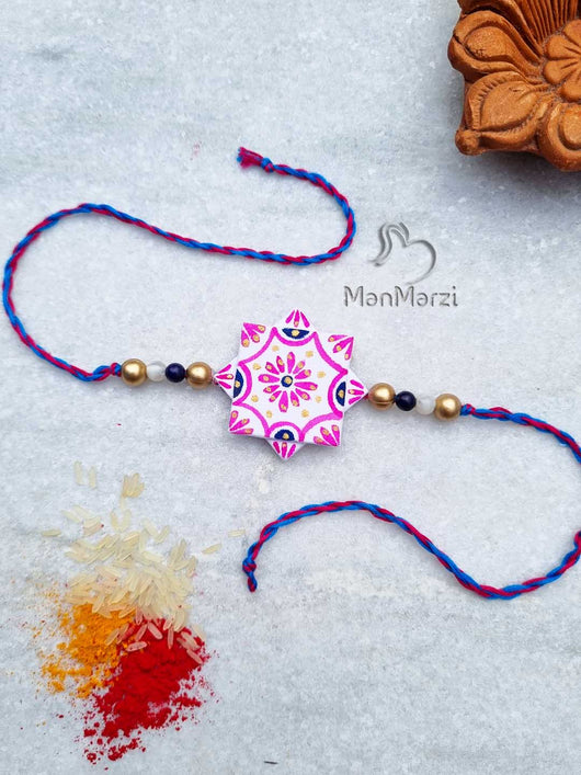 Buy online Handpainted Rakhi with Floral Charm | manmarzi.com