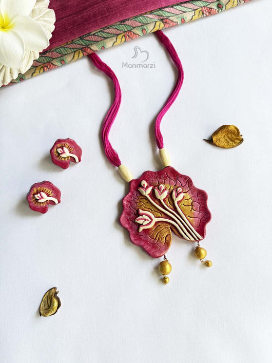 Decorative pink necklace with floral design